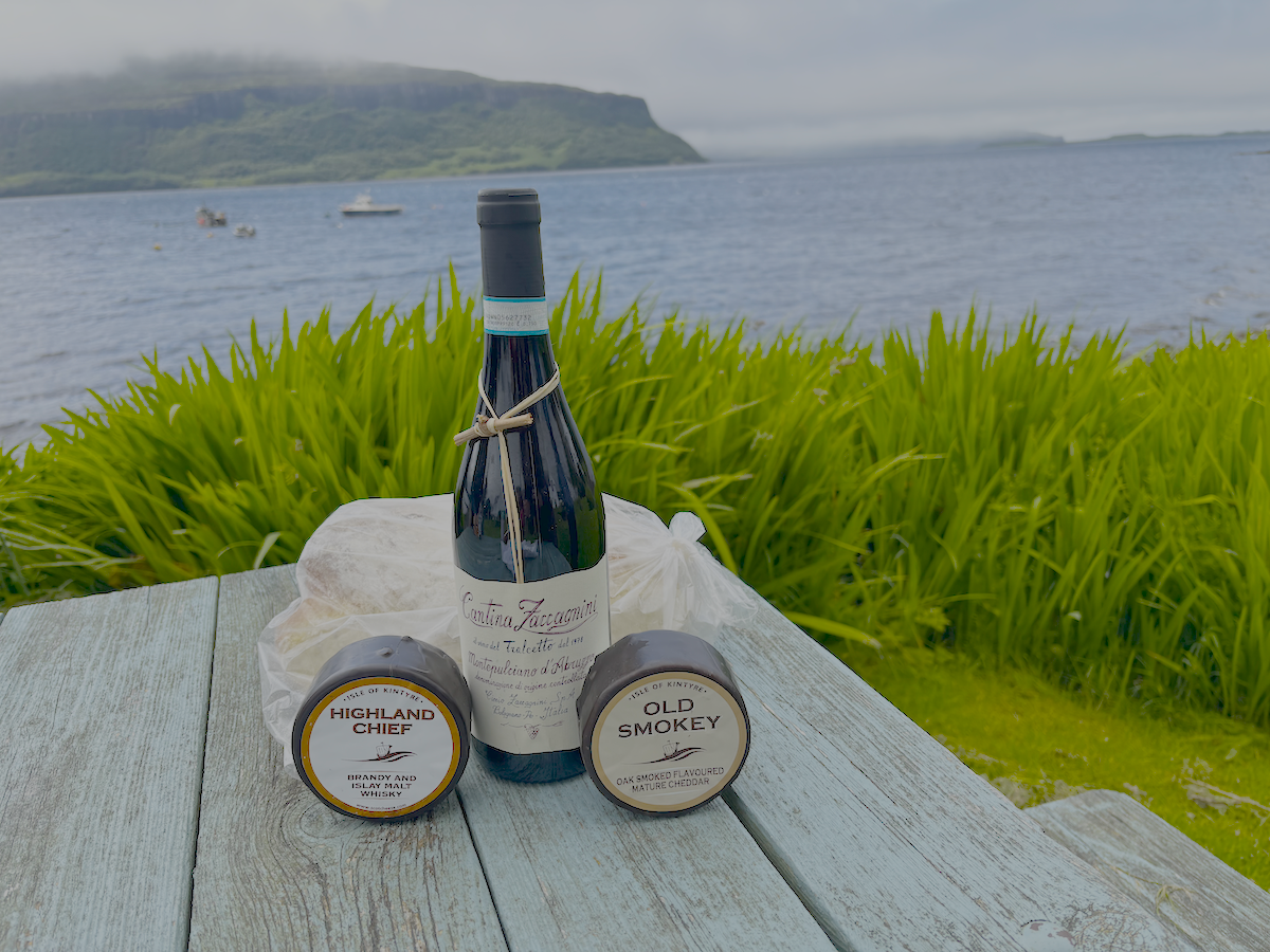 Cheese and wine and bread by the sea